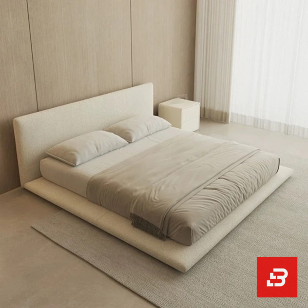Minimalist low-profile upholstered platform bed in off-white bouclé fabric with extended base frame by Bahoo Furniture UAE