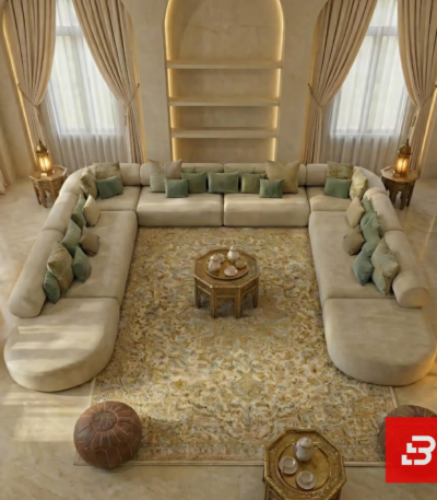 Overhead view of a luxury upholstered U-shaped sectional sofa in cream beige velvet fabric arranged in a grand living room with recessed wall shelving by Bahoo Furniture UAE