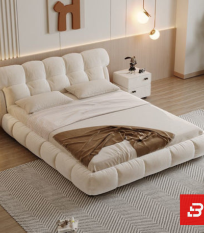Pillow-top channel upholstered platform bed in ivory white velvet fabric with segmented plump backrest by Bahoo Furniture UAE