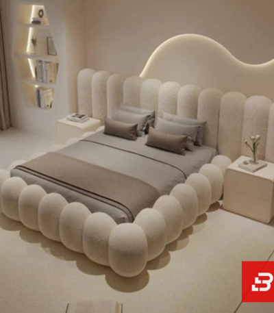 Sculptural bubble upholstered platform bed in cream bouclé fabric with rounded vertical bubble cushioning by Bahoo Furniture UAE