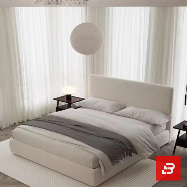 Minimalist paneled upholstered platform bed in soft cream bouclé fabric with clean vertical split headboard by Bahoo Furniture UAE