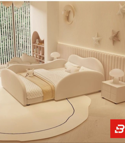 Scalloped-arch kids platform bed in cream velvet fabric with rounded side rails by Bahoo Furniture UAE