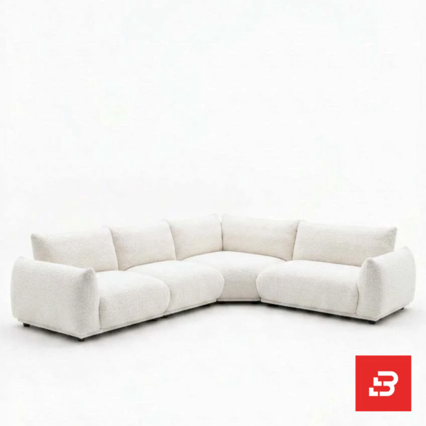 Studio product view of a luxury upholstered modular l-shape sectional sofa in off white bouclé fabric featuring deep plush cushions and wide padded armrests by Bahoo Furniture UAE