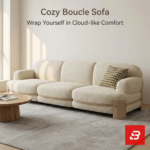 Designed for Modern Living interior view of a luxury wood-trim sofa and matching armchair upholstered in textured beige bouclé fabric featuring natural wooden structural framing and clean low-profile lines by Bahoo Furniture UAE