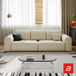 Bright modern living room interior view of a luxury tufted sofa upholstered in textured off white bouclé fabric featuring plush channel-tufted seating cushions and clean modern lines by Bahoo Furniture UAE
