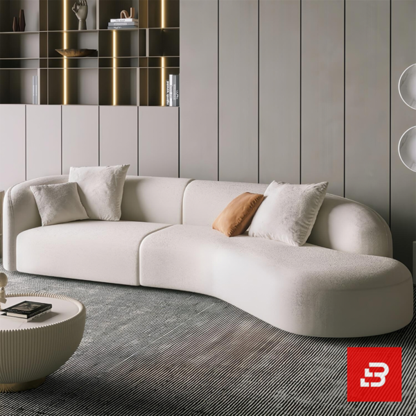Bright modern luxury living room interior showcasing a curved sofa upholstered in textured off white bouclé fabric featuring an elegant sweeping architectural profile and soft accent cushions by Bahoo Furniture UAE