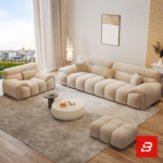 Bright elegant modern living room interior showcasing a luxury modular channel sofa upholstered in textured beige bouclé fabric featuring vertical channel tufting and stylish accent pillows by Bahoo Furniture UAE