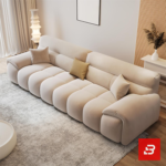 Bright elegant modern living room interior showcasing a luxury modular channel sofa upholstered in textured beige bouclé fabric featuring vertical channel tufting and stylish accent pillows by Bahoo Furniture UAE