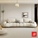 Bright warm modern living room interior showcasing a luxury plissé sectional sofa set upholstered in textured beige bouclé fabric featuring horizontal channel tufting and wooden feet accents by Bahoo Furniture UAE