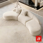 Overhead high-angle interior view of a luxury curved sectional sofa upholstered in textured off white bouclé fabric featuring an organic curved silhouette and scatter cushions by Bahoo Furniture UAE