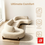 Sunlit luxury living room interior view of a luxury modular curved sofa upholstered in textured off white bouclé fabric featuring fluid wooden base detailing by Bahoo Furniture UAE