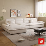 Sunlit luxury living room interior view of a luxury plush cushion sofa upholstered in soft off white fabric featuring deep channeled cushions and matching throw pillows by Bahoo Furniture UAE