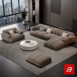 Sleek modern penthouse living room interior view of a luxury channel tufted sectional sofa upholstered in textured warm gray fabric featuring matching armchair and ottoman by Bahoo Furniture UAE