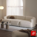 Warm modern apartment living room interior view of a luxury l-shaped sectional sofa upholstered in textured off white bouclé fabric featuring an extended chaise lounge and rust accent pillows by Bahoo Furniture UAE