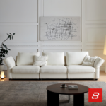 Warm elegant living room interior view of a luxury plump cushion sofa upholstered in textured off white bouclé fabric featuring deep plush back pillows and angled armrests by Bahoo Furniture UAE