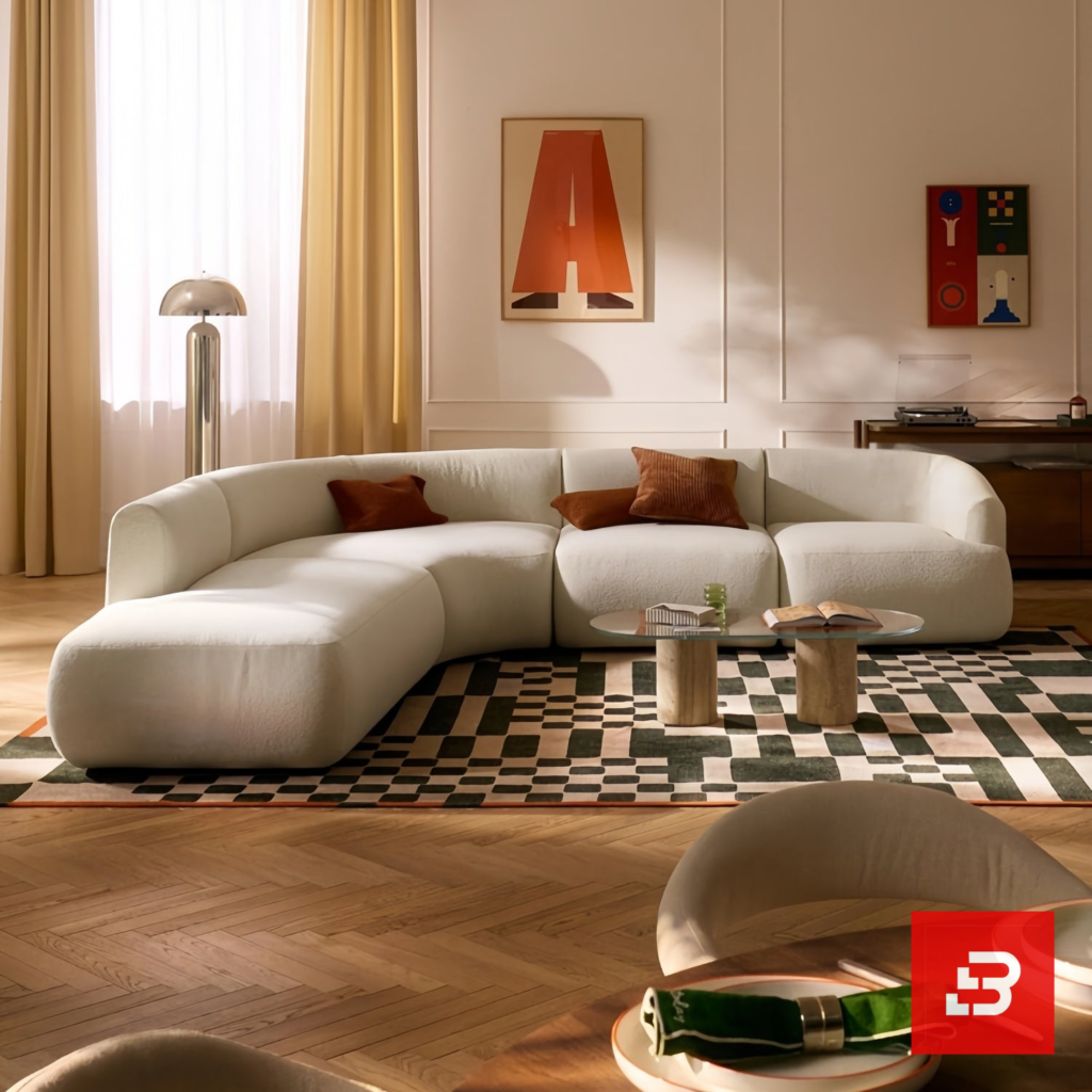 Sunlit modern luxury villa living room interior view of a luxury u-shaped modular sectional upholstered in textured off white bouclé fabric featuring a matching ottoman and rust throw pillows by Bahoo Furniture UAE