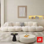 Bright minimalist modern living room interior view of a luxury cloud modular sofa set upholstered in textured off white bouclé fabric featuring independent modules, an armchair, and a matching ottoman by Bahoo Furniture UAE