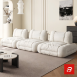 Bright elegant apartment living room interior view of a luxury independent modular lounge sofa upholstered in textured off white bouclé fabric featuring separate modular armchair elements by Bahoo Furniture UAE