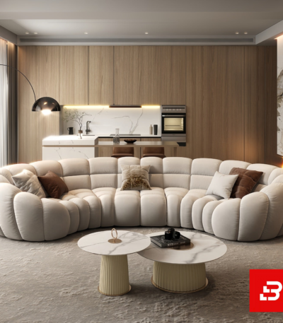 Luxurious open-concept modern living room interior showcasing a magnificent curved channel sectional sofa upholstered in textured beige bouclé fabric featuring segmented pillowy modules and warm throw pillows by Bahoo Furniture UAE