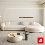 Sunlit luxury living room interior showcasing a sprawling curved chaise lounge sofa and matching armchair upholstered in textured off white bouclé fabric featuring sweeping rounded contours and a round coffee table by Bahoo Furniture UAE