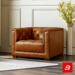Classic elegant living room interior showcasing a luxury chesterfield sofa upholstered in rich beige leather fabric featuring deep button tufting and rolled arms by Bahoo Furniture UAE