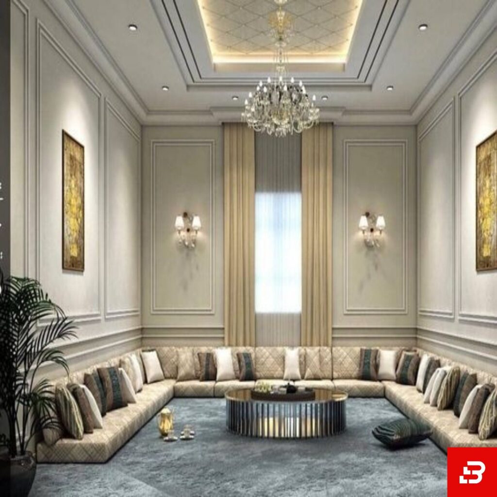 Royal velvet floor majlis sectional sofa in silver grey fabric arranged in a modern structured living room with wainscoting walls by Bahoo Furniture UAE