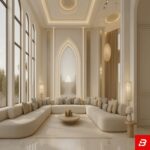 Interior view of a luxury upholstered grand majlis sectional sofa in beige velvet fabric set against tall arched windows and grand architectural columns by Bahoo Furniture UAE