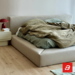 Contemporary tailored upholstered platform bed in soft ivory fabric by Bahoo Furniture UAE
