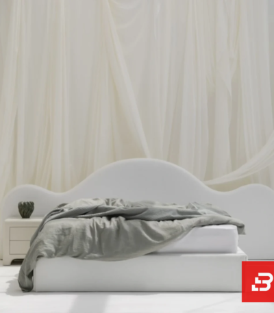 Arched minimalist upholstered platform bed in cream bouclé fabric by Bahoo Furniture UAE