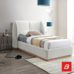 Wingback upholstered platform bed in cream bouclé fabric by Bahoo Furniture UAE