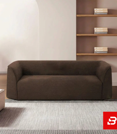 Modern minimalist living room interior showcasing a luxury low-profile sofa upholstered in soft warm gray textured fabric featuring seamless rounded armrests and a clean silhouette by Bahoo Furniture UAE