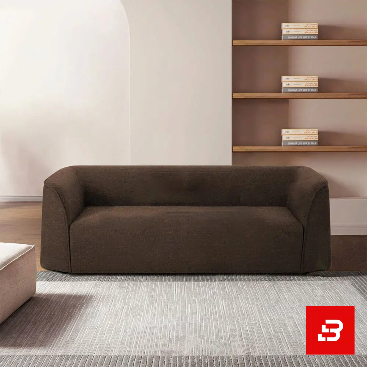 Bahoo Luxury Minimalist Sofa Upholstered - Bahoo Furniture Modern minimalist living room interior showcasing a luxury low-profile sofa upholstered in soft warm gray textured fabric featuring seamless rounded armrests and a clean silhouette by Bahoo Furniture UAE