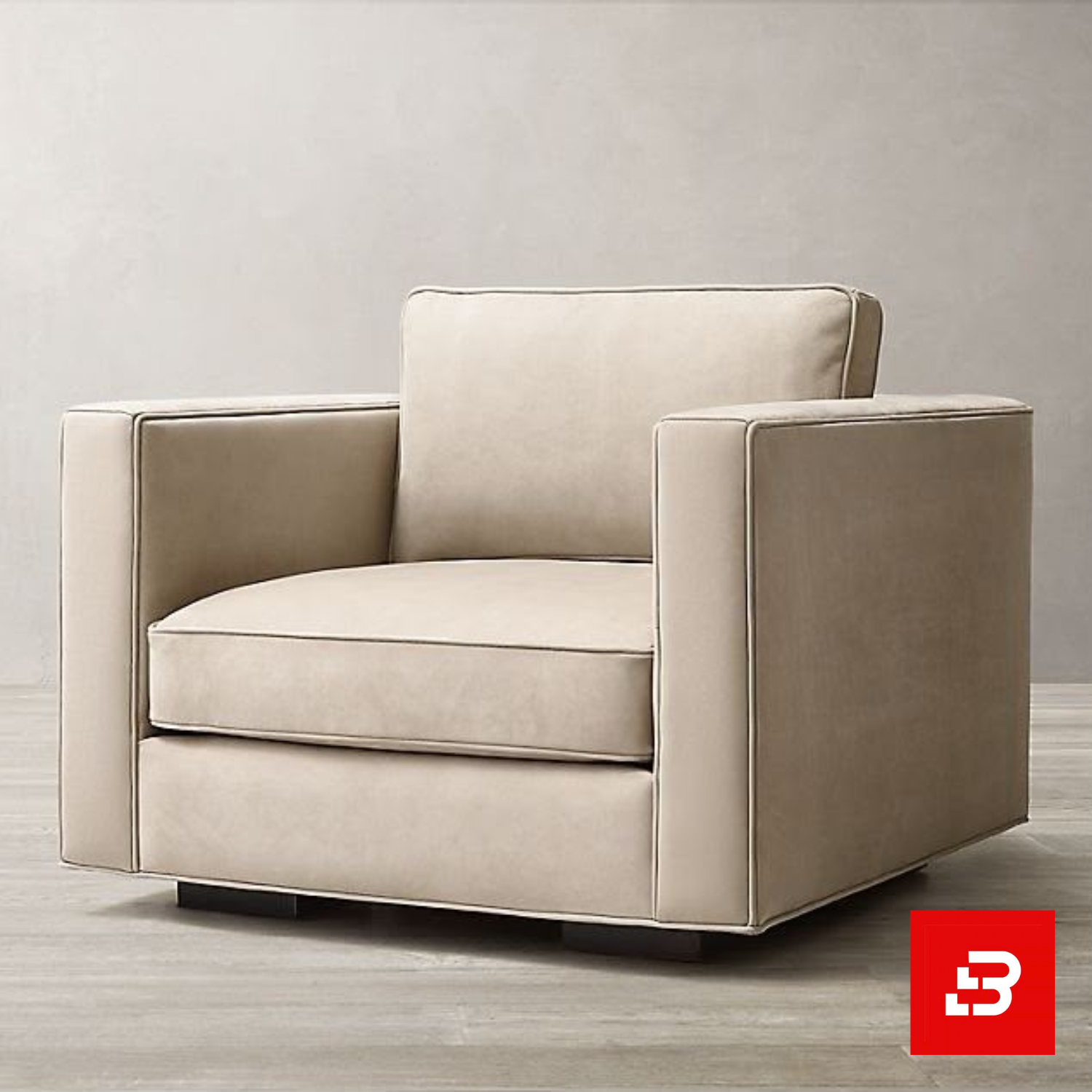 Bahoo Luxury Square Frame Armchair Upholstered - Bahoo Furniture Modern minimalist living room featuring a plush beige velvet square frame armchair with subtle piping details on dark wooden feet by Bahoo Furniture UAE