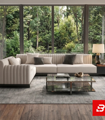 Stunning floor-to-ceiling glass window living room interior showcasing a modern l-shape fluted sectional sofa upholstered in off white fabric with contrasting throw pillows and a glass coffee table by Bahoo Furniture UAE