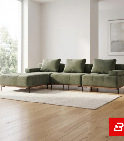 Bright modern living room interior showcasing a contemporary l-shape tufted sectional sofa upholstered in soft beige velvet with matching plush cushions and slender legs by Bahoo Furniture UAE