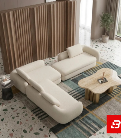 Aerial view of a contemporary interior showcasing an off white bouclé modular sectional sofa paired with an organic marble coffee table and terrazzo flooring by Bahoo Furniture UAE