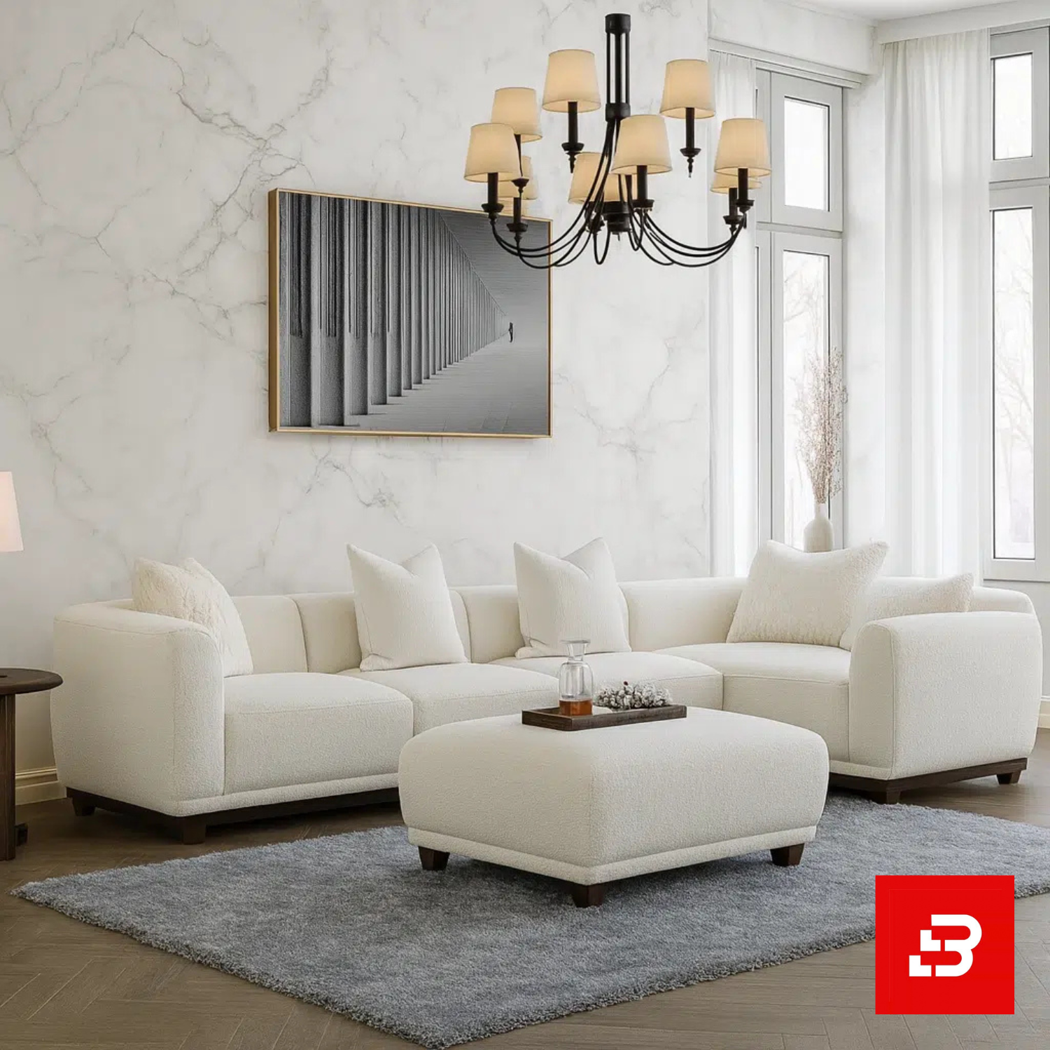 Bahoo Luxury L-Shape Sectional Sofa Upholstered - Bahoo Furniture Luminous classic living room interior showcasing an off white bouclé l-shape sectional sofa with a matching ottoman, vintage chandelier, and marble accent wall by Bahoo Furniture UAE