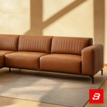 Sunlit modern living room interior showcasing a beige leatherette l-shape sectional sofa with vertical channel tufting, slim black metal legs, and warm minimalist wall lighting by Bahoo Furniture UAE