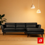 Warmly lit modern living room interior showcasing a gray leatherette l-shape sectional sofa with slender dark wooden legs, hanging pendant lights, and indoor plant by Bahoo Furniture UAE