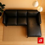 Warmly lit modern living room interior showcasing a gray leatherette l-shape sectional sofa with slender dark wooden legs, hanging pendant lights, and indoor plant by Bahoo Furniture UAE