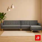 Warmly lit modern living room interior showcasing a warm gray fabric tufted l-shape sectional sofa with deep button tufting, gleaming gold metal legs, pendant lights, and indoor plant by Bahoo Furniture UAE