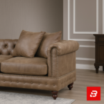 Opulent classic living room interior featuring a beige tufted chesterfield l-shape sectional sofa with matching tufted ottoman, rolled arms, nailhead trim, and a modern arc floor lamp by Bahoo Furniture UAE