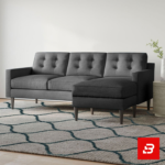 Modern minimalist living room featuring a tufted warm gray fabric l-shape sectional sofa with button details, wooden tapered legs, and a patterned rug by Bahoo Furniture UAE