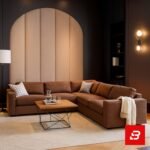 Sophisticated modern living room interior showcasing a luxury l-shape sectional sofa upholstered in rich beige textured fabric featuring plush cushions and an arched paneled wall backdrop by Bahoo Furniture UAE