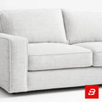 Sophisticated modern living room interior showcasing a luxury l-shape sectional sofa upholstered in rich beige textured fabric featuring plush cushions and an arched paneled wall backdrop by Bahoo Furniture UAE