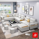 Sleek modern luxury living room interior showcasing an extensive modular sectional sofa upholstered in soft warm gray fabric featuring integrated armrest storage pockets and matching ottomans by Bahoo Furniture UAE
