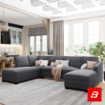 Bright and airy open-concept modern living room interior showcasing a grand u-shape sectional sofa upholstered in soft off white fabric featuring dual chaise ends and decorative throw pillows by Bahoo Furniture UAE