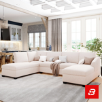 Bright and airy open-concept modern living room interior showcasing a grand u-shape sectional sofa upholstered in soft off white fabric featuring dual chaise ends and decorative throw pillows by Bahoo Furniture UAE