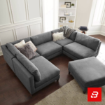 Overhead view of a modern luxury living room interior showcasing a grand u-shape sectional sofa upholstered in soft warm gray textured fabric with plush faux-fur accent pillows and matching ottoman by Bahoo Furniture UAE