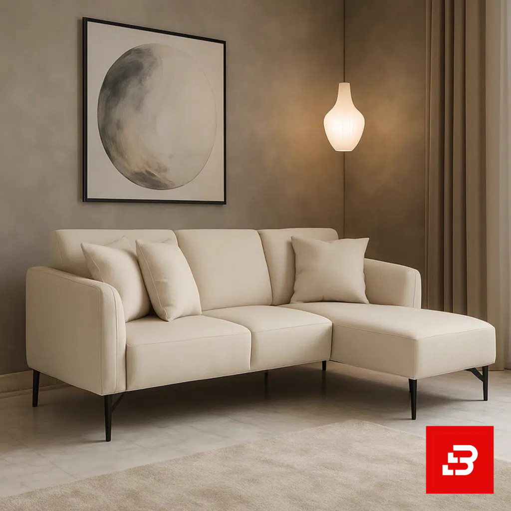 Cozy and minimalist modern living room interior showcasing a compact l-shape sectional sofa upholstered in soft off white fabric paired with a matching chaise lounge and abstract wall art by Bahoo Furniture UAE